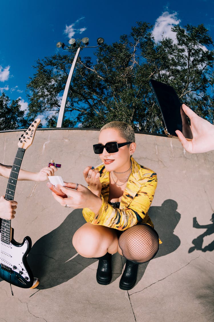 Woman In Sunglasses Posing In Skatepark