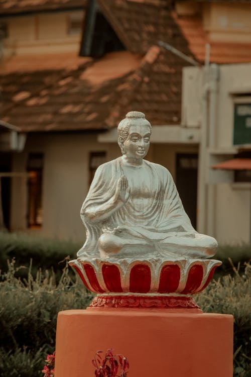 Buddha Sculpture with Building behind