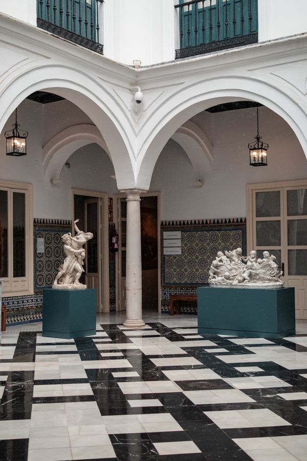 Tiled courtyard with statuary — Alex Quezada on Pexels