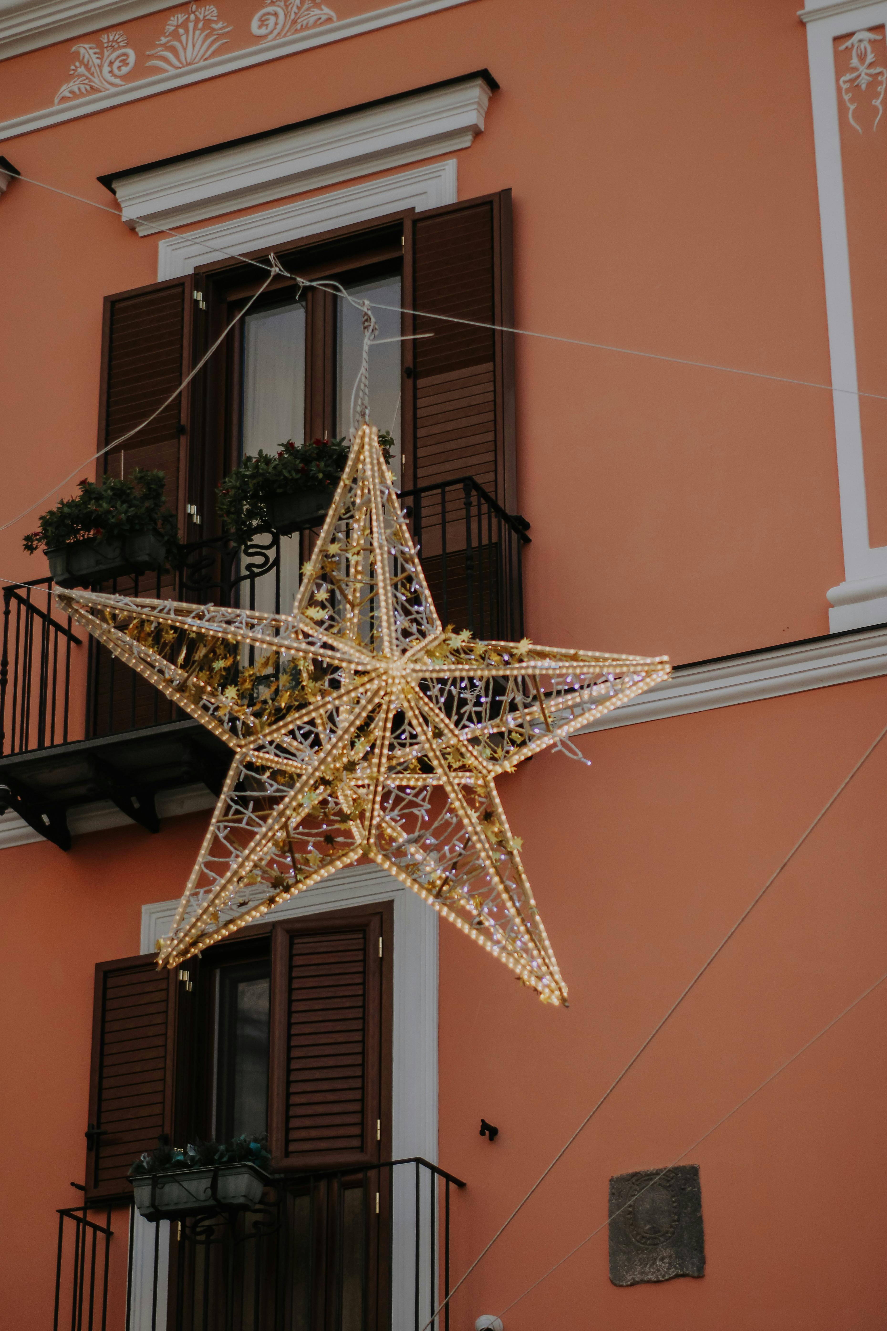 star decoration near building