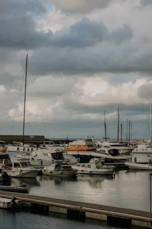 Motor Yachts Moored under Clouds