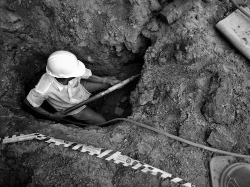 Miner Working in Black and White