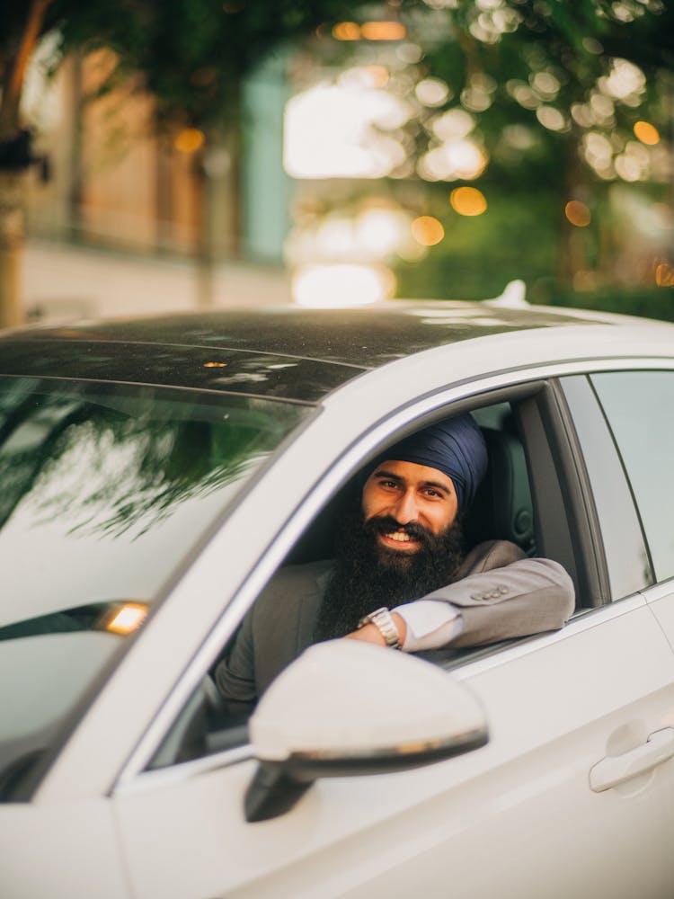 Bearded Man Driving Luxurious Car