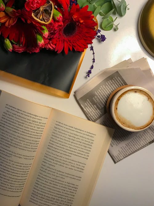Coffee, Newspaper, Book and Flowers