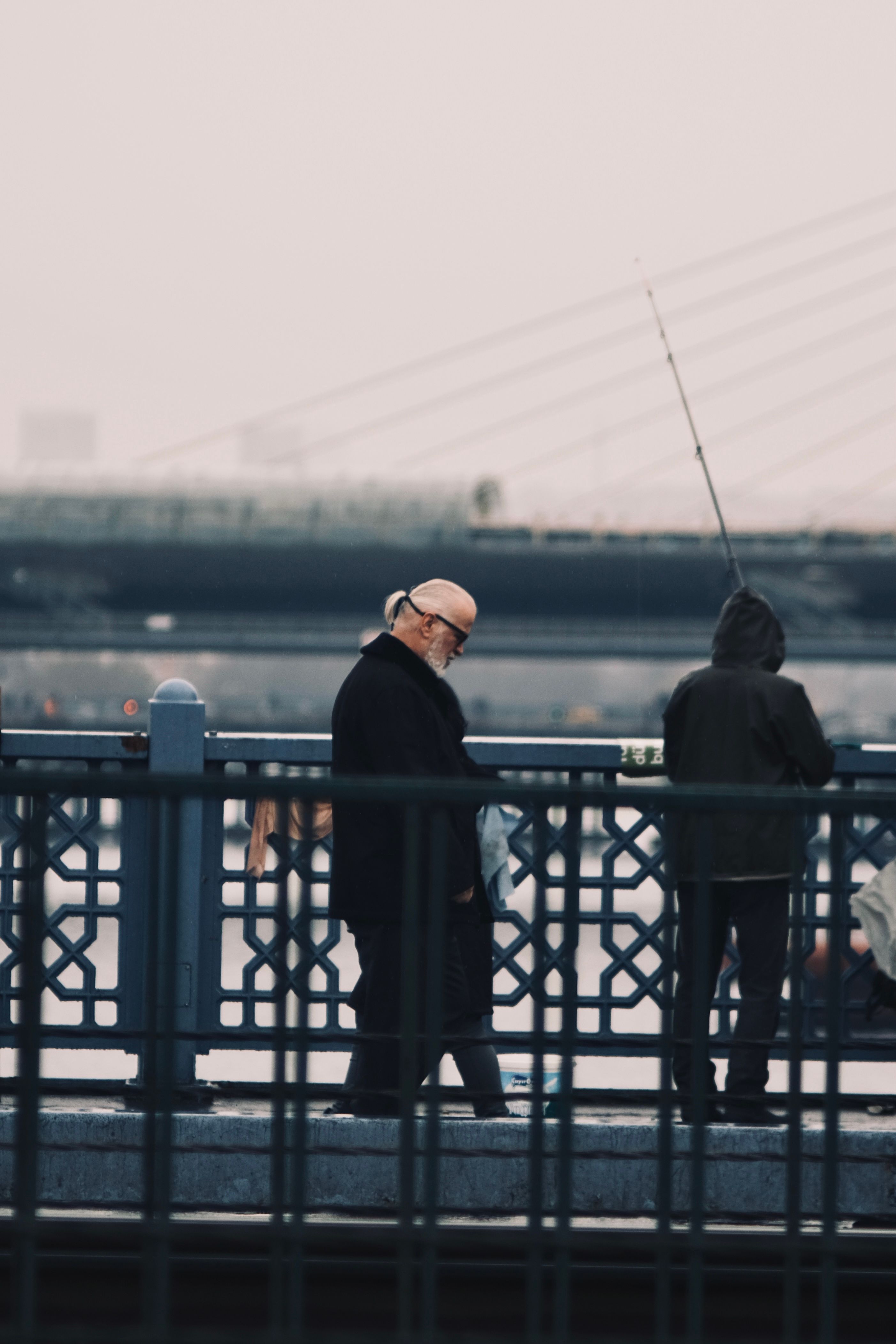 Silhouette of Man Walking near the Railings · Free Stock Photo
