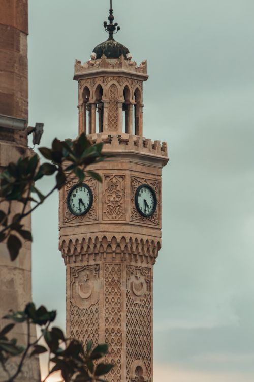 Free Detailed view of the historic İzmir Clock Tower under a cloudy sky in Türkiye. Stock Photo