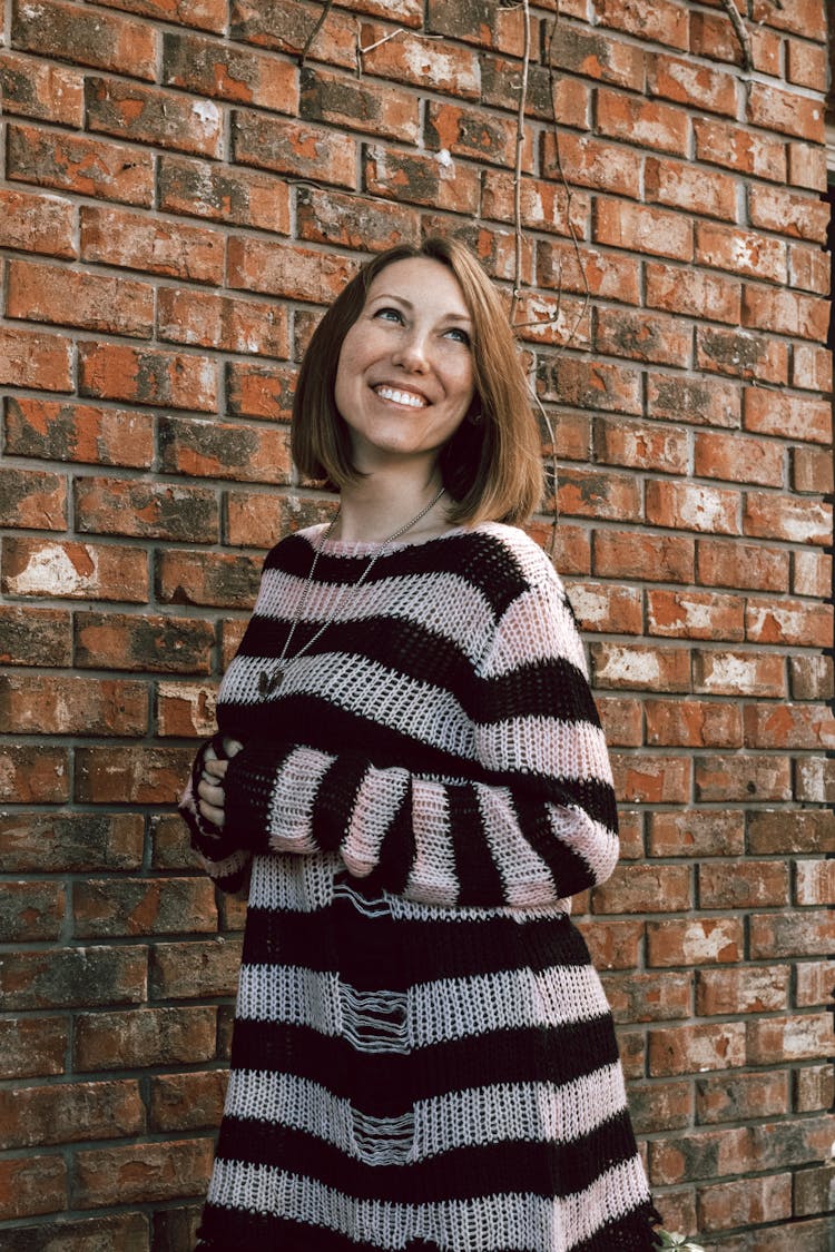 Happy Brunette Woman In Sweater