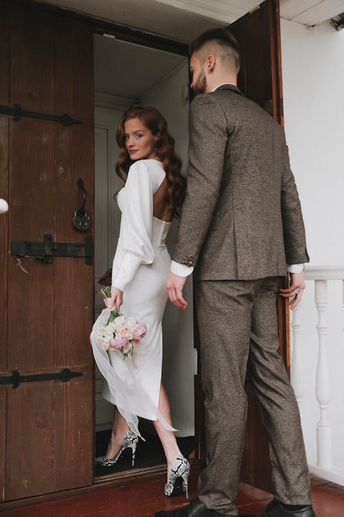 Bride and Groom Walking through the Door 