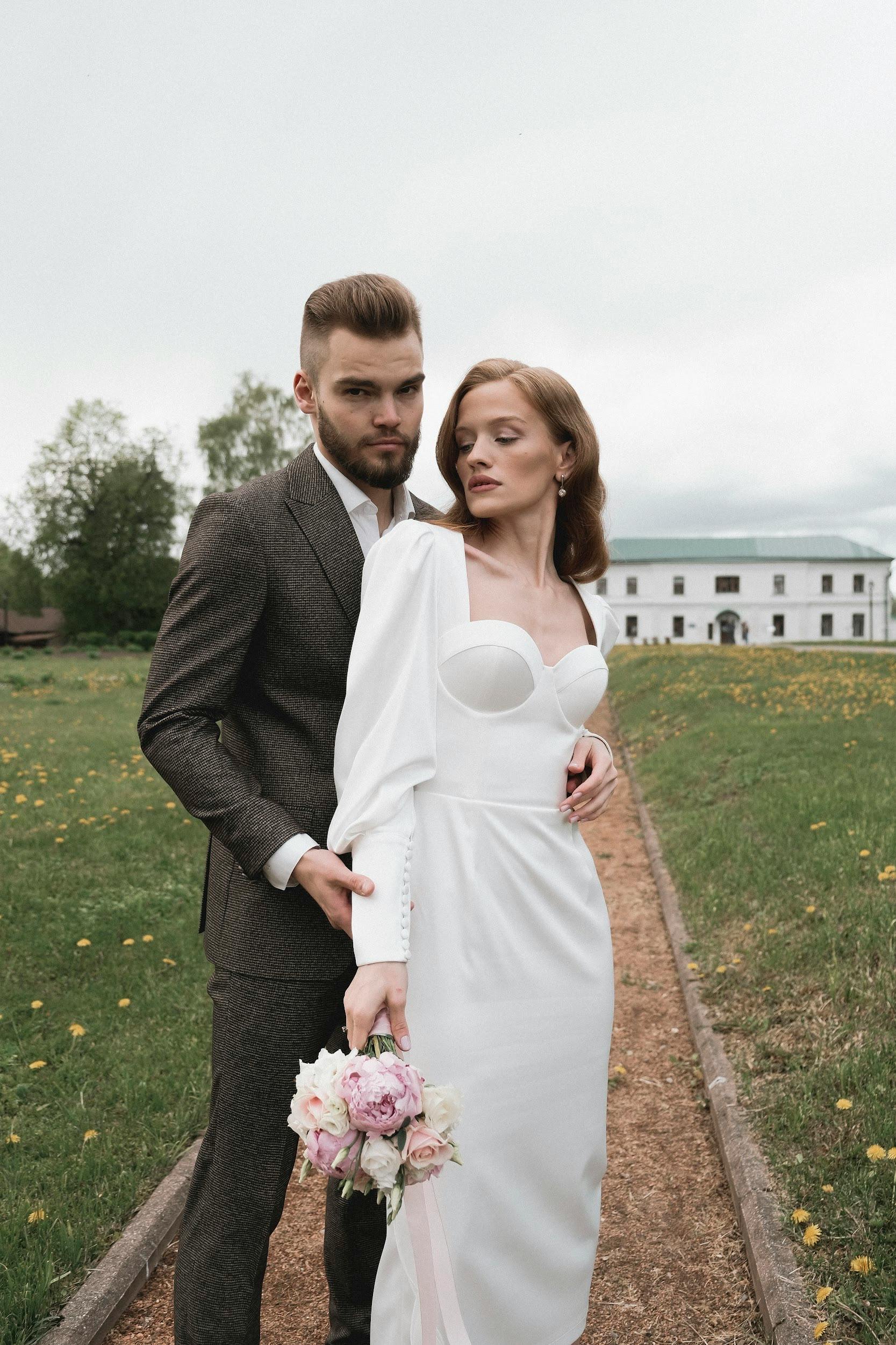 portrait of newlyweds standing together