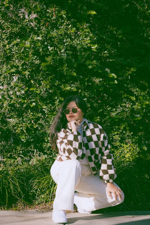 Young Fashionable Woman Posing Outdoors in Summer 