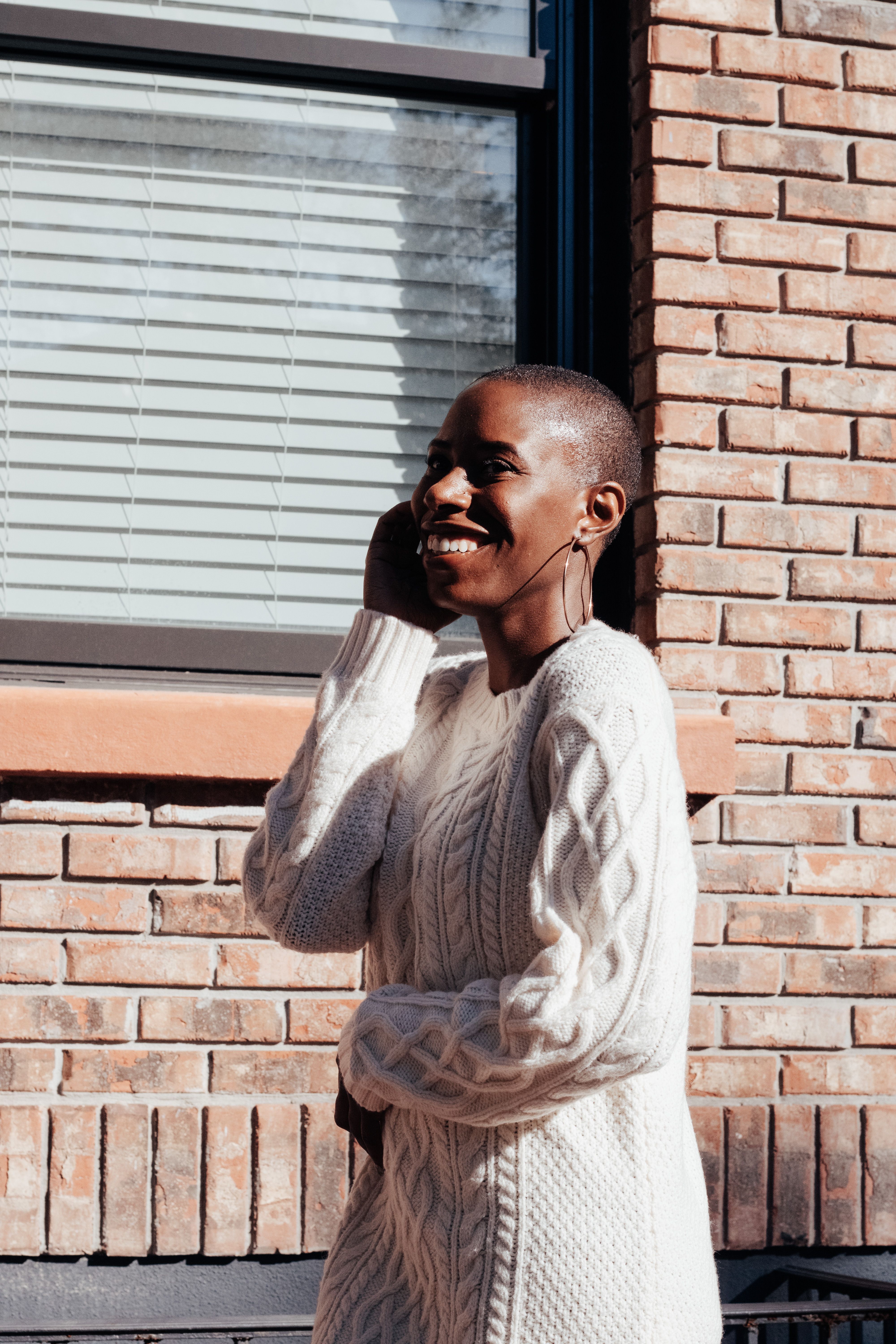 Young Woman Posing Outdoors in Sunlight · Free Stock Photo
