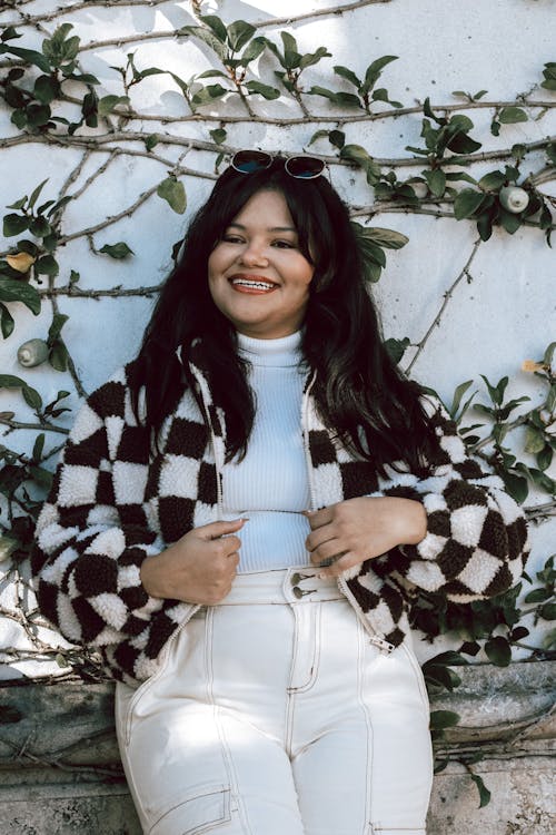 Smiling Woman in White Pants