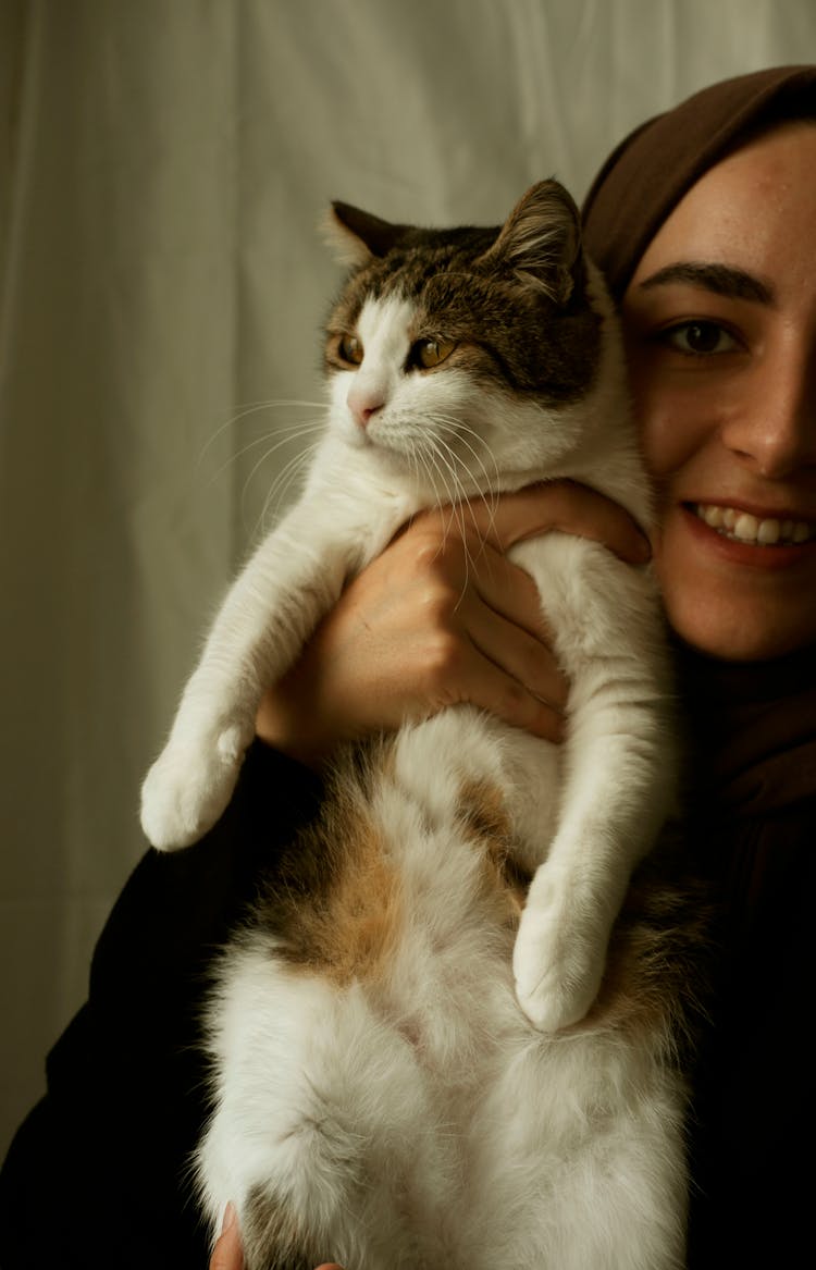 Smiling Woman Holding Cat