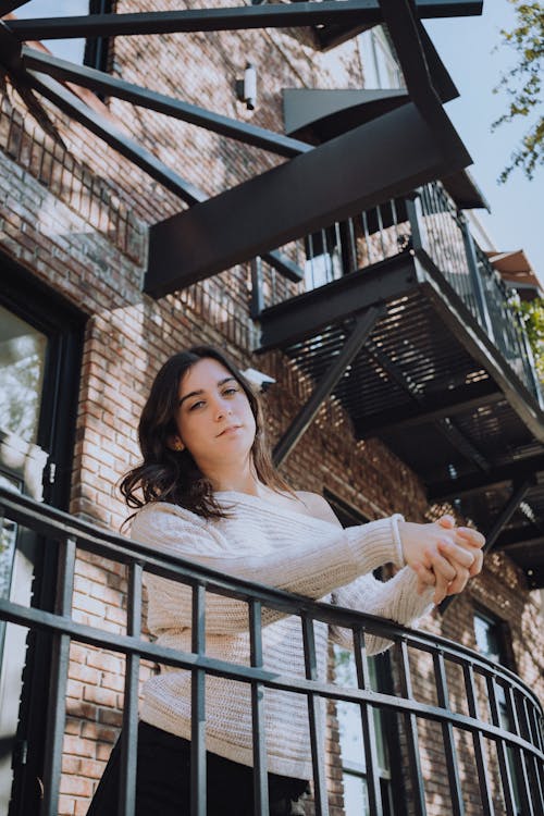 Woman Standing on a Balcony 