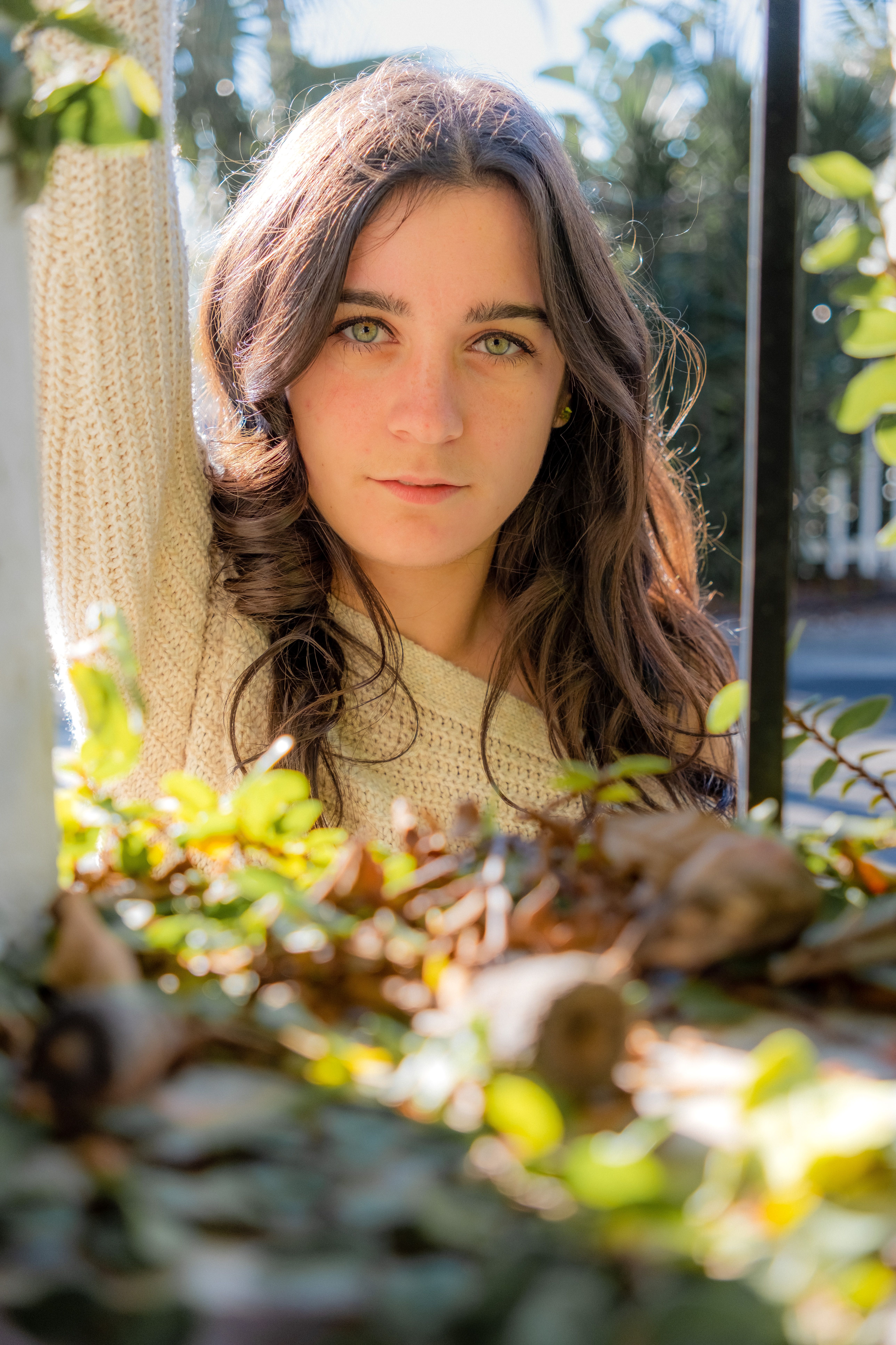 Young Brunette Posing Outdoors in Sunlight · Free Stock Photo