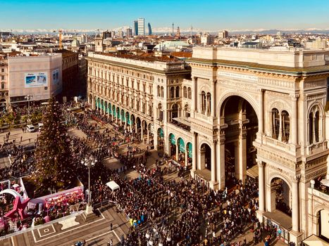 A bustling scene at Galleria Vittorio Emanuele II in Milan during the holiday season.