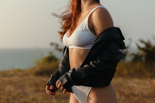 Toned Woman in Underwear and Jacket Posing in Nature