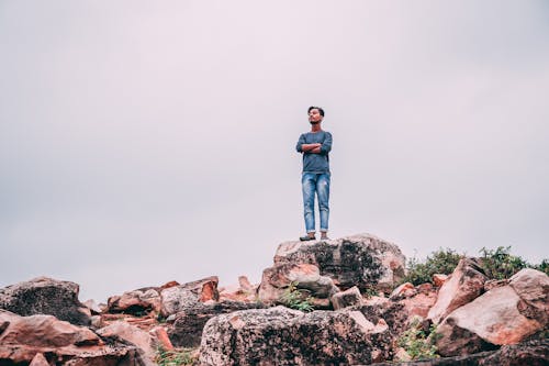 Man Standing On Rock