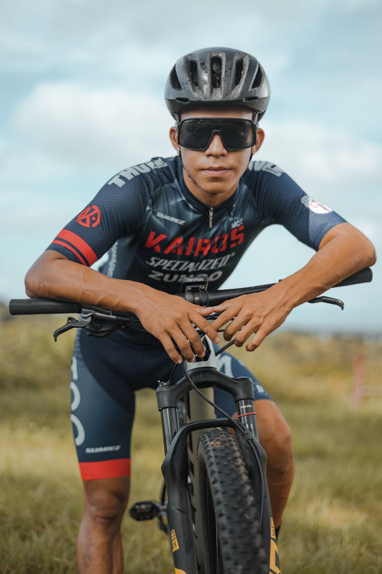 Cyclist With Helmet Posing On Bike