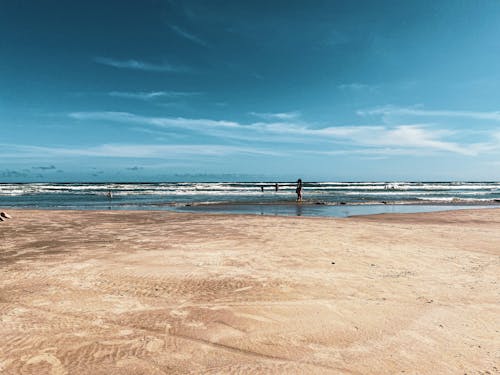 Foto profissional grátis de água, areia, beira-mar