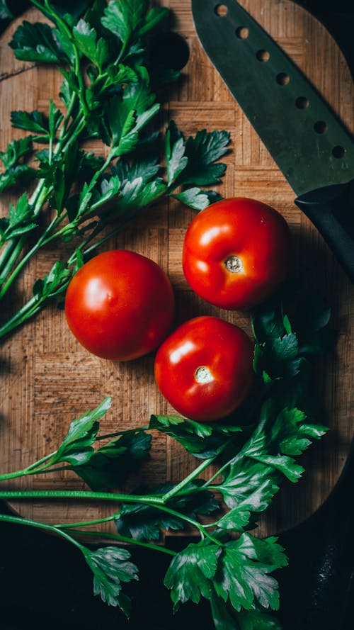 Tomatoes and Herbs on Cutting Board