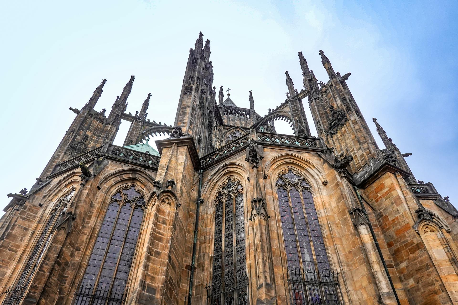 Explore the stunning Gothic facade of St. Vitus Cathedral, a landmark in Prague's historic architecture.