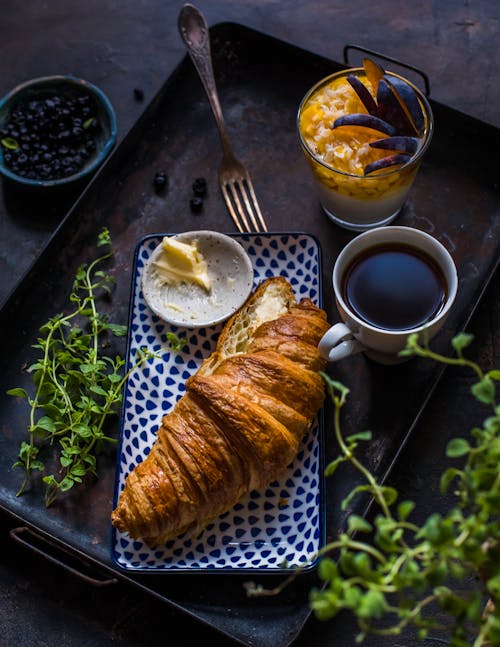 Free Croissant on a Decorated Plate Stock Photo