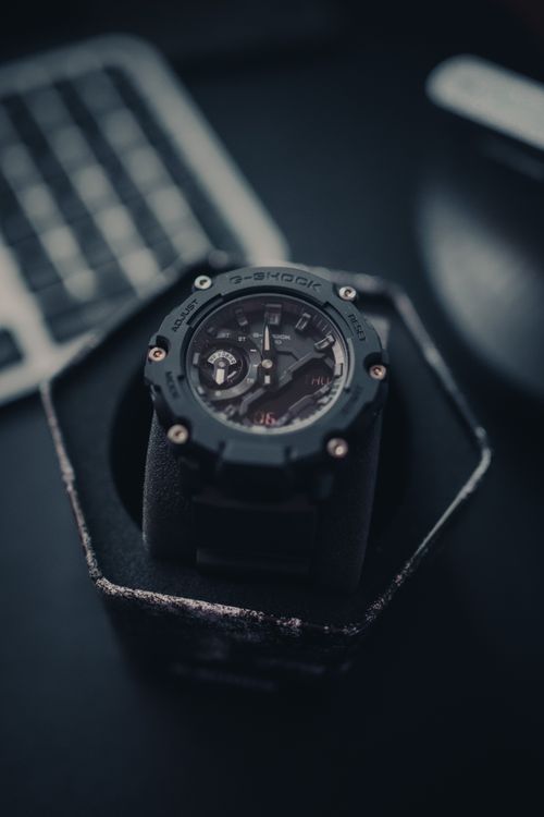 Free Stylish wristwatch in luxury box on dark background, sleek design. Stock Photo