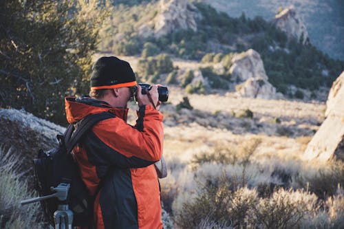 Free Photograph of a Man Taking Pictures Outdoors Stock Photo