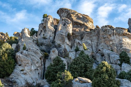 Free Explore stunning rock formations under a clear blue sky in a serene natural landscape. Stock Photo