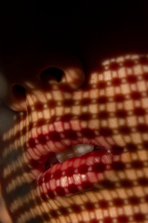 Close-up of Pattern Created by a Shadow on Womans Face