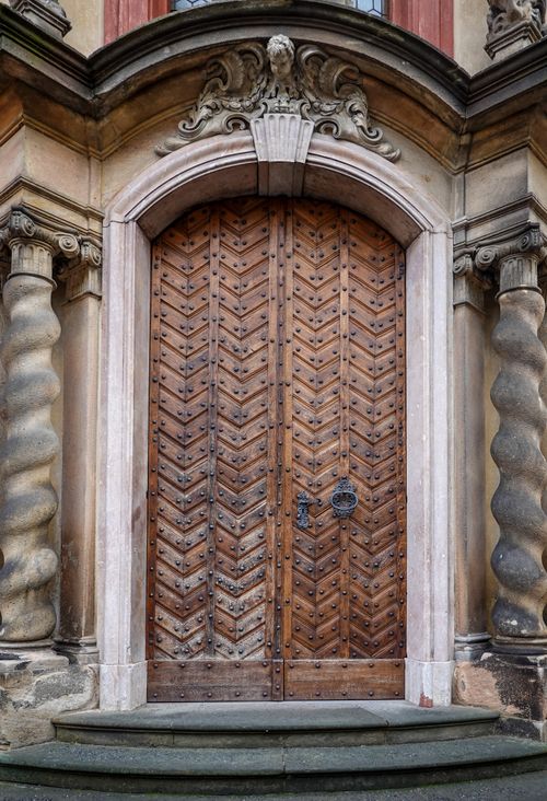 Free Intricately designed wooden church door with ornate stone carvings in Prague, Czechia. Stock Photo