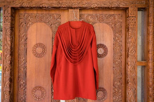 Red Clothes on Wooden Door
