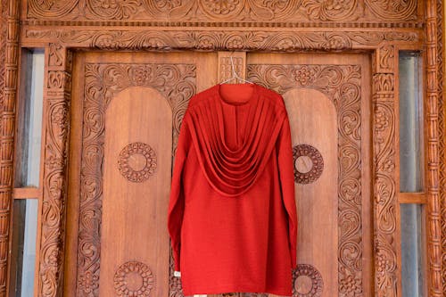 Red Clothes on Ornamented Door