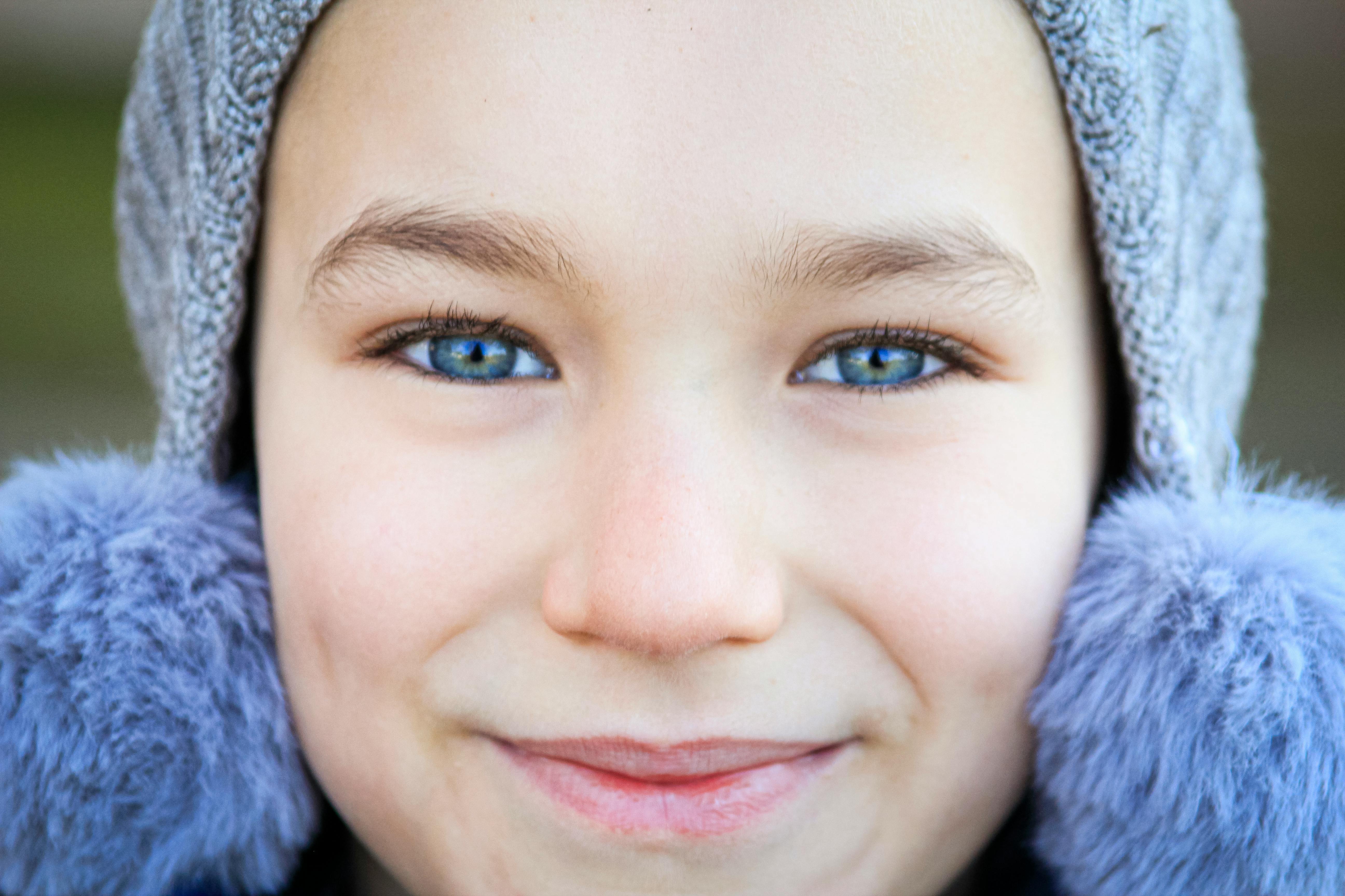 A Smiling Kid With Blue Eyes · Free Stock Photo