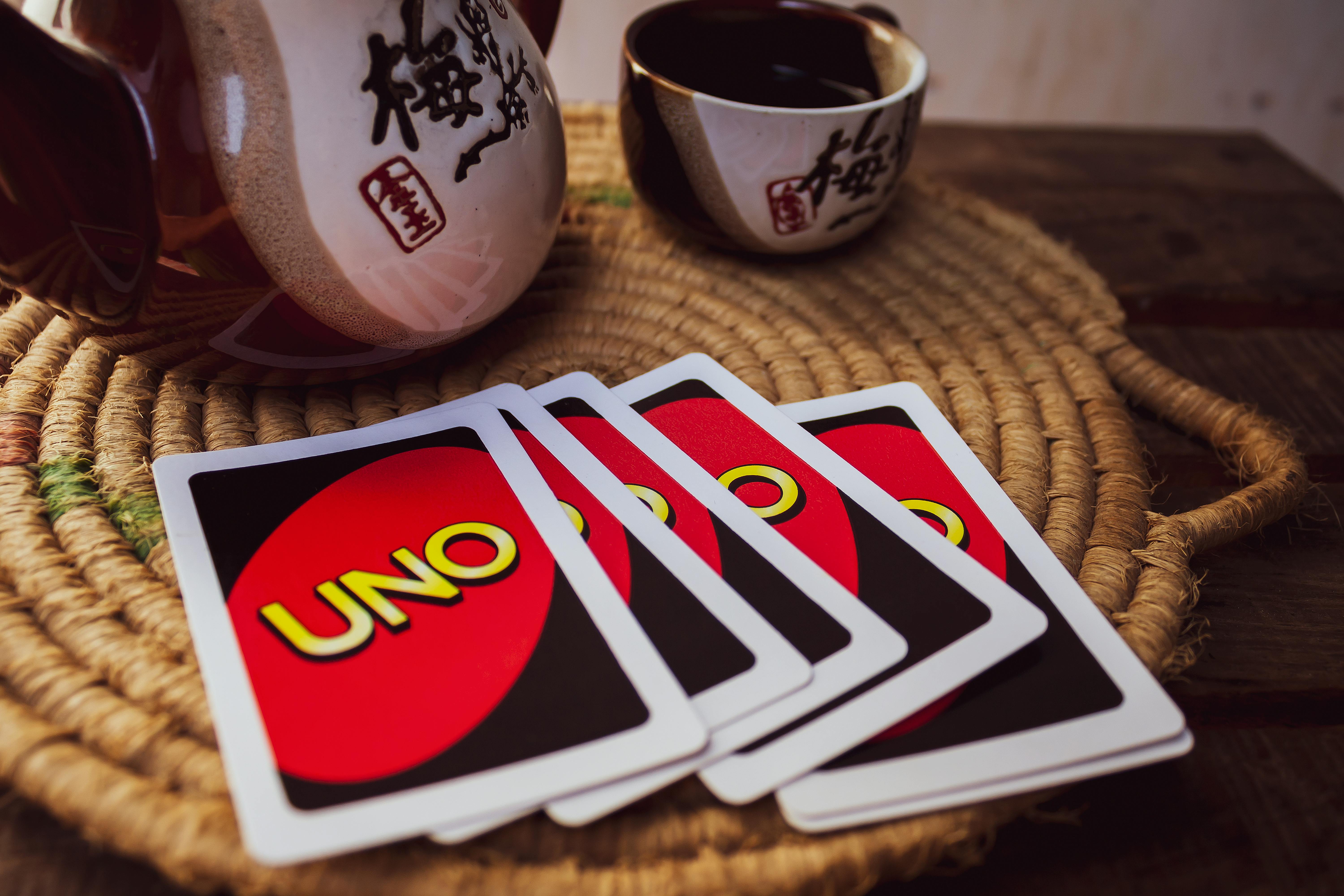 Teapot and Teacup Beside Uno Cards on Round Woven Placemat · Free Stock ...