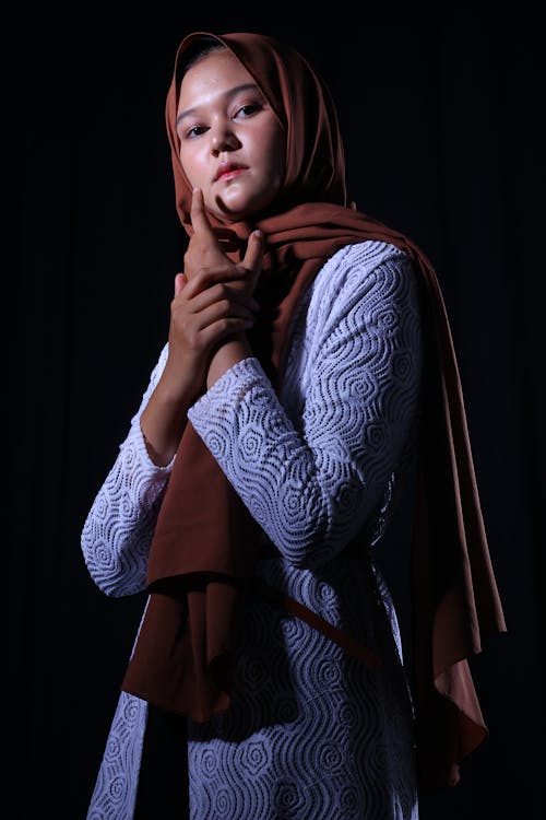 Photo of a Woman Wearing Brown Headscarf