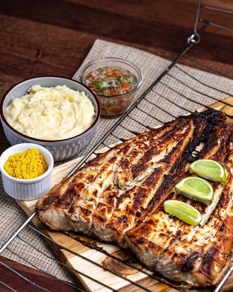 Meat Steak On Grill On Table