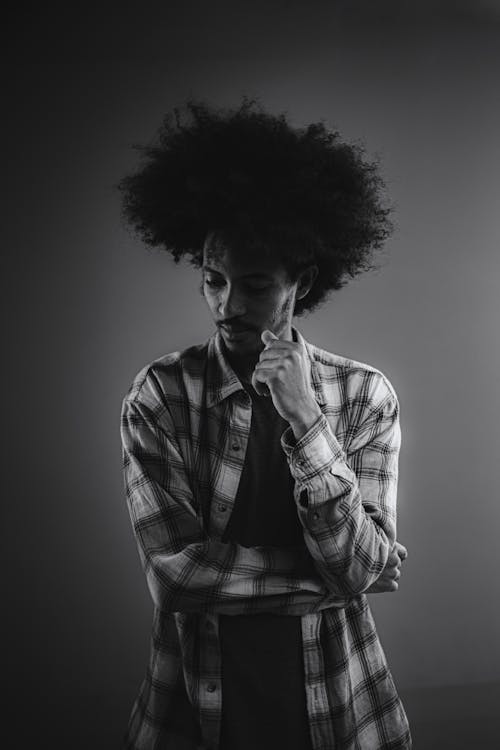 Grayscale Portrait of a Man With Afro Hair 