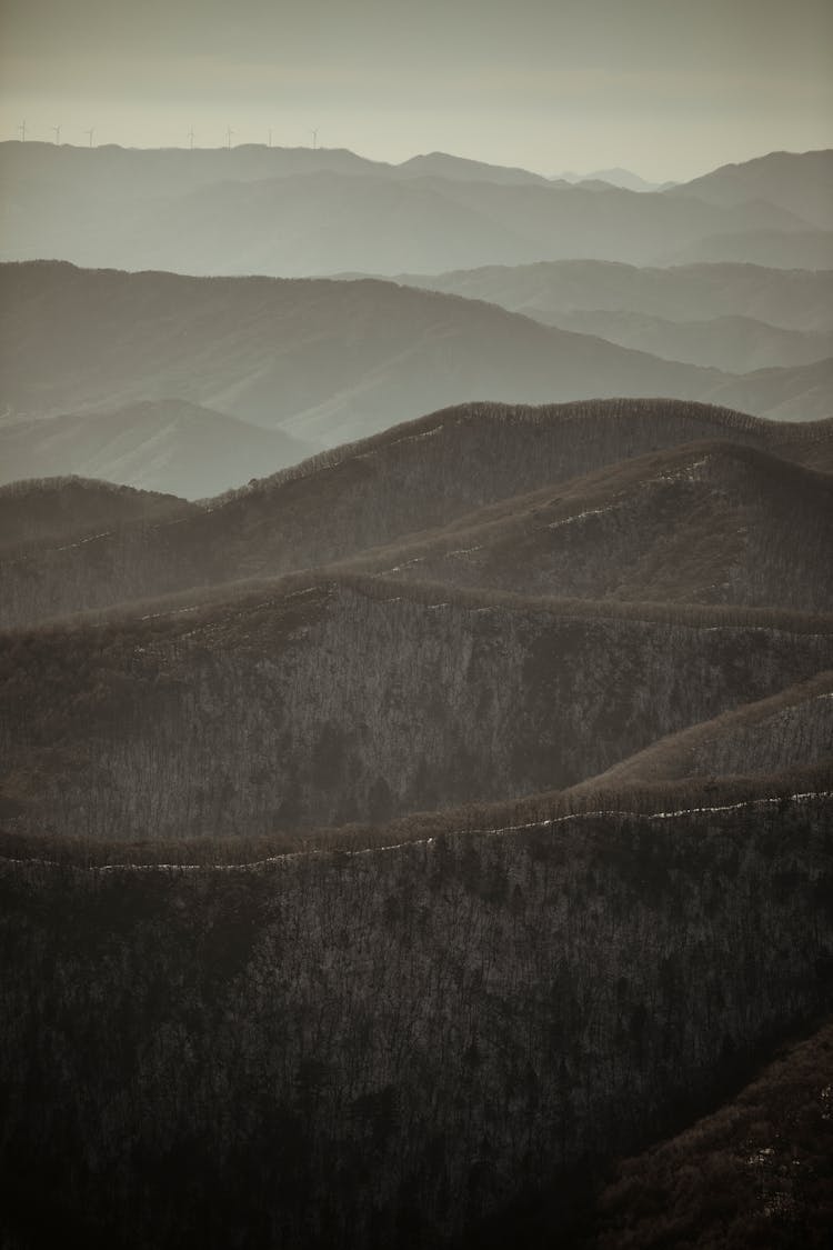 Grayscale Photo Of Hills 