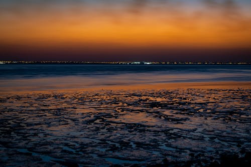 Безкоштовне стокове фото на тему «Берегова лінія, березі моря, Захід сонця» стокове фото