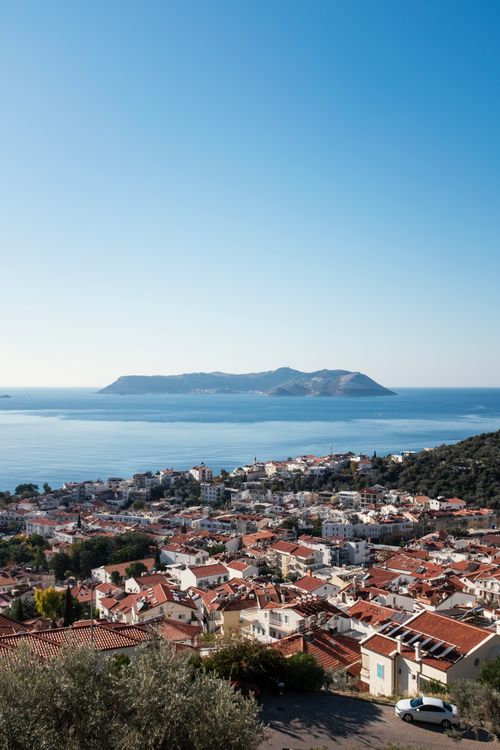 Free Scenic aerial view of Kaş, Antalya showcasing the town and Mediterranean Sea under a clear sky. Stock Photo