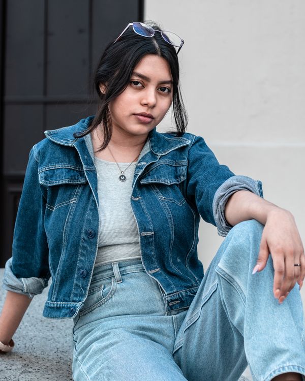 Woman in denim jacket and jeans