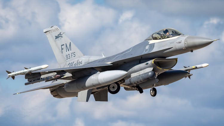 F16 Jet Fighter Flying In The Sky