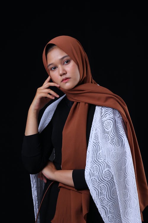 Woman Wearing Brown Hijab with Her Hand on Her Face