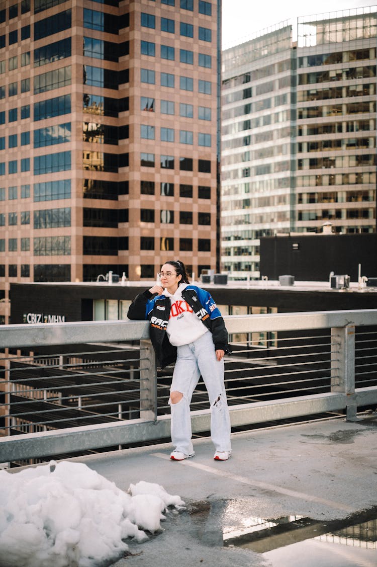 Fashionable Young Woman On A Terrace Of A Skyscraper 