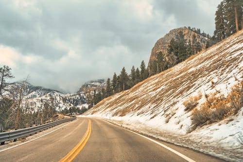 Empty Road among Hills in Winter
