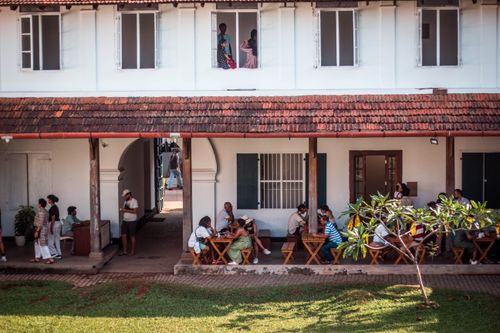 Free Outdoor café setting in Kochi, Kerala, India with people dining and socializing. Stock Photo