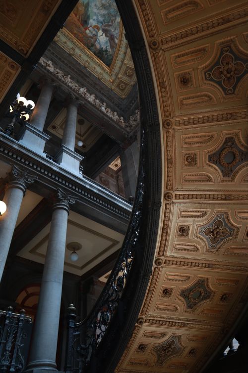 Free Ornate architectural staircase with intricate designs in a historic building interior. Stock Photo