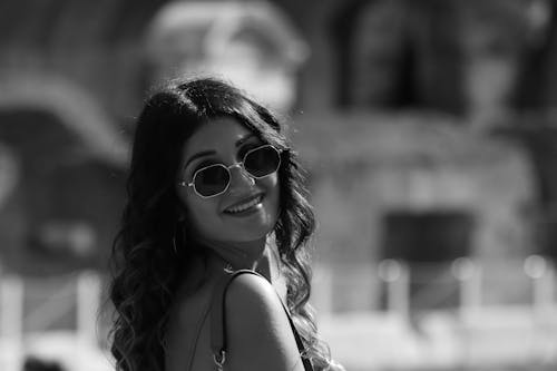 Grayscale Photo of Woman Wearing Sunglasses